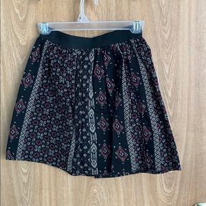 Adorable black patterned skirt.